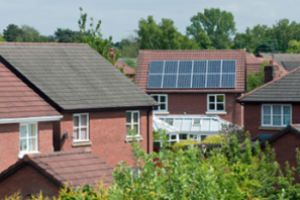 house with solar panels 300x198