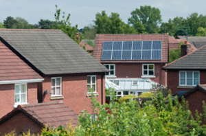 house with solar panels 300x198